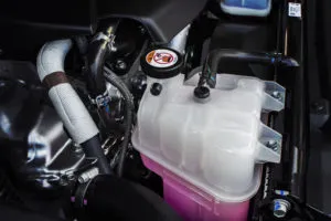 Coolant Tank With A Pink Liquid Antifreeze Of A Radiator System